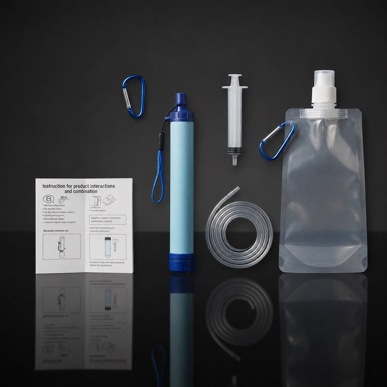 Filter straw kit laid flat: quick-start card, carabiner clip, filter straw, backflush syringe, intake extension tube and 1.5L collapsible reservoir